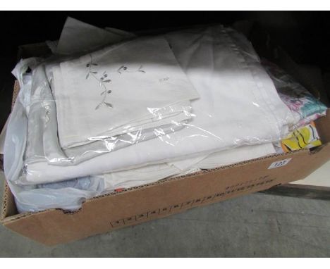 A box of assorted textiles.