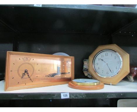 A shelf of assorted clocks.