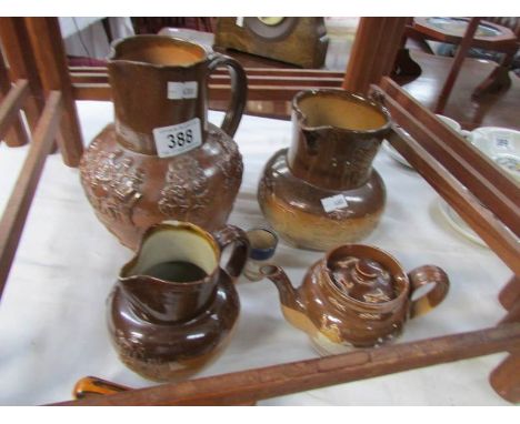 3 stoneware jugs, a stoneware teapot and a miniature stoneware jug, some a/f.