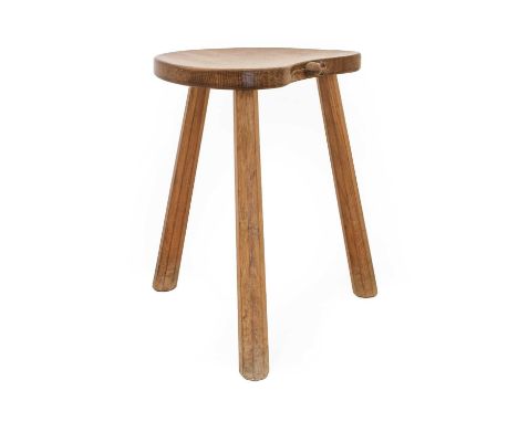 Workshop of Robert Mouseman Thompson (Kilburn): An English Oak Cow Stool, the kidney shaped seat on three octagonal legs, wit