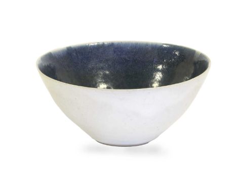 Dame Lucie Rie (1902-1995): A Stoneware Bowl, circa 1983, blue glazed interior and cream glazed exterior, impressed LR potter