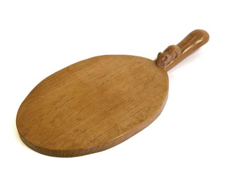 Workshop of Robert Mouseman Thompson (Kilburn): An English Oak Cheese Board, post 1960, of standard form, with carved mouse t