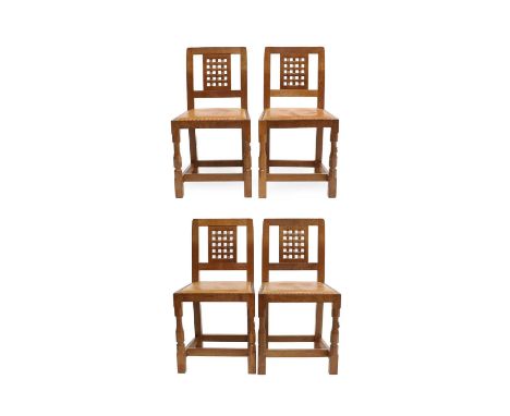 Workshop of Robert Mouseman Thompson (Kilburn): A Set of Four English Oak Lattice Back Dining Chairs, tan leather upholstered