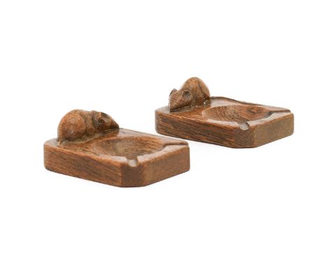 Robert Mouseman Thompson (1876-1955): Two English Oak Ashtrays, 1950s, of standard rectangular form, each with carved mouse t