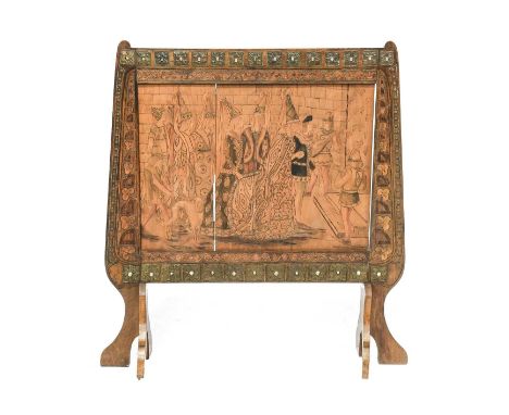 An Arts &amp; Crafts French Pokerwork Yellow Birch Fire Screen, depicting a wedding scene, embellished with glass and metal, 