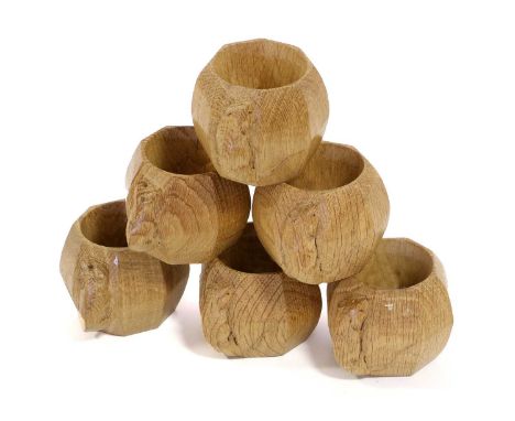 Workshop of Robert Mouseman Thompson (Kilburn): Six English Oak Napkin Rings, of octagonal form, each with carved mouse trade
