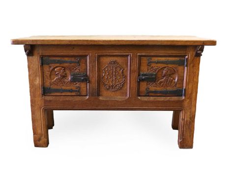 Robert Mouseman Thompson (1876-1955): A Rare English Oak Hutch Cupboard, circa 1926, the overhanging dowelled two-plank top w