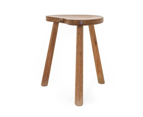 Workshop of Robert Mouseman Thompson (Kilburn): An English Oak Cow Stool, the kidney shaped seat on three octagonal legs, wit