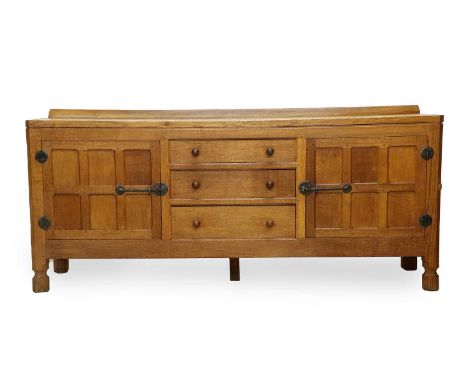 Workshop of Robert Mouseman Thompson (Kilburn): An English Oak 6ft Sideboard, with raised upstand, adzed top over two cupboar