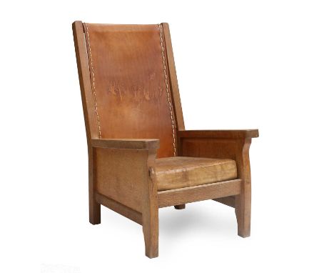 Workshop of Robert Mouseman Thompson (Kilburn): An English Oak Smoking Chair, slung leather back, straight arms, solid seat a