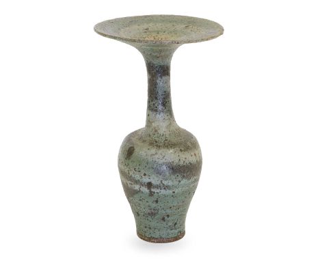 Dame Lucie Rie (1902-1995): A Stoneware Bottle Vase, circa 1983, with flaring rim, spiralling pale green volcanic glaze, impr