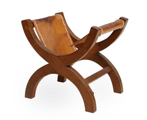 Workshop of Robert Mouseman Thompson (Kilburn): An English Oak X Stool, the slung hide seat (damaged) supported by two X legs