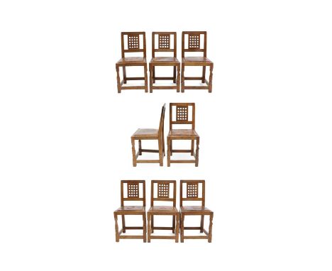 Workshop of Robert Mouseman Thompson (Kilburn): A Set of Eight English Oak Lattice Back Dining Chairs, tan leather upholstere