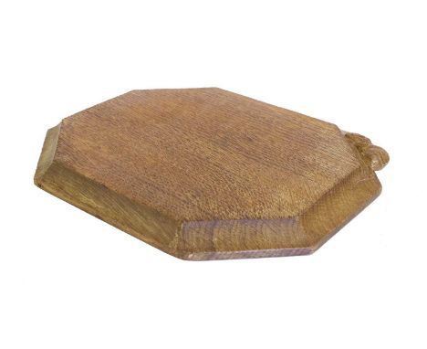 Robert Mouseman Thompson (1876-1955): An English Oak Bread Board, of canted rectangular shape, with carved mouse trademark,30