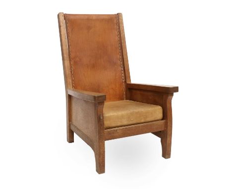 Workshop of Robert Mouseman Thompson (Kilburn): An English Oak Smoking Chair, slung leather back, straight arms, solid seat a