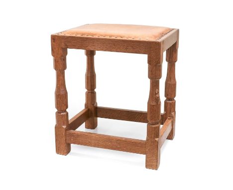 Workshop of Robert Mouseman Thompson (Kilburn): An English Oak Dressing Table Stool, with upholstered leather seat, on four o