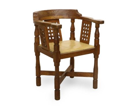 Workshop of Robert Mouseman Thompson (Kilburn): An English Oak Monk's Chair, with curved back and shaped arms, over three lat