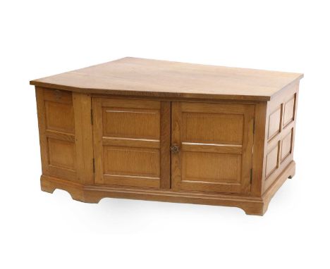 Wren Cabinet Makers: Bob Hunter (Thirlby): An English Oak Panelled Television Corner Stand, flat top, above two doors with a 