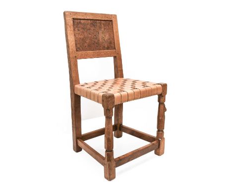 Robert Mouseman Thompson (1876-1955): An English Oak Chair, 1930s, burr oak panel back, lattice leather seat, on octagonal fr