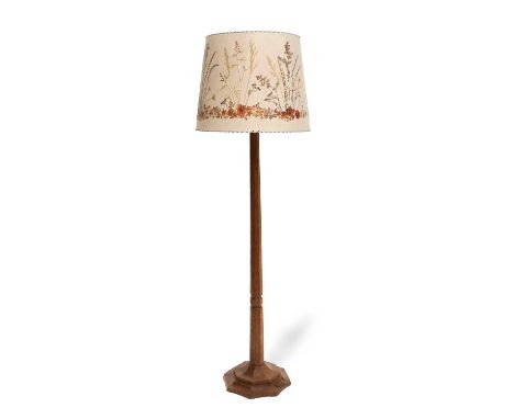 Workshop of Robert Mouseman Thompson (Kilburn): An English Oak Standard Lamp, octagonal column and base, with carved mouse tr