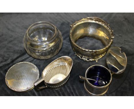 A Georgian style silver cylindrical mustard pot, the hinged cover with shell thumbpiece, Chester 1924 and a plated spoon, a V