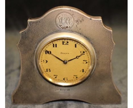 An Art Deco silver strut clock with Swiss movement, the engine turned silver case with monogram, Birmingham 1924, 9.5cm high 