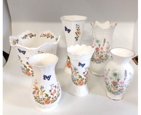 A collection Of Aynsley china, in the Wild Tudor and Cottage Garden pattern. Vases, pin trays and lidded pots. Lot to include