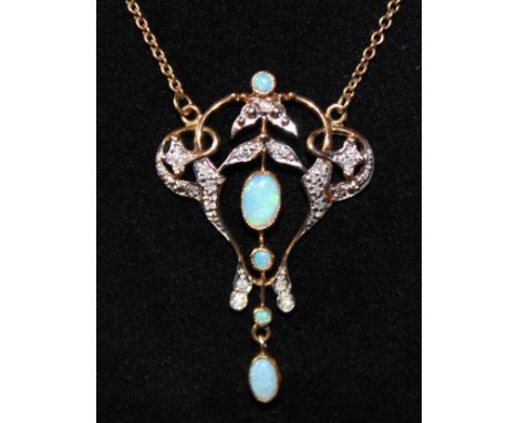 Unmarked Yellow Metal Art Nouveau in style Opal and Diamond Pendant and '10K' hallmarked Gold fine Chain.  The pendant consis