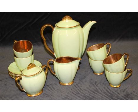 A Carlton Ware coffee service for six in green and gilt including coffee pot, cream jug and sugar basin some glaze crazing th