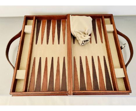 TRAVELLING BACKGAMMON SET, tan leathered case, 23cm W x 40cm D x 7cm H.