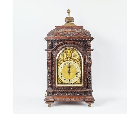 BRACKET CLOCK, late 19th century oak, by Manoah Rhodes and Sons Ltd, Bradford, brass finial pine cone top above carved green 