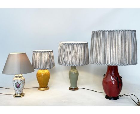 TABLE LAMPS, Sang de Boeuf, oxblood ceramic with iron mounts together, two Chinese style lamps and a vase lamp, all with shad