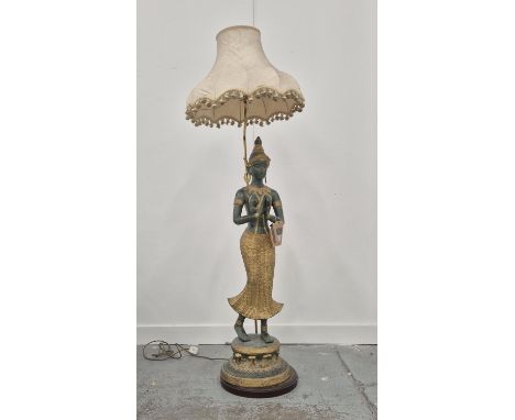 A THAI FIGURAL FLOOR LAMP, verdigris and gilt metal with shade, 165cm H.
