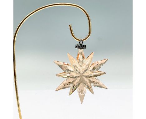 Dazzling star or snowflake shaped tree ornament in goldtone crystal. Swarovski mark. This item has its original box: 5.5"L x 
