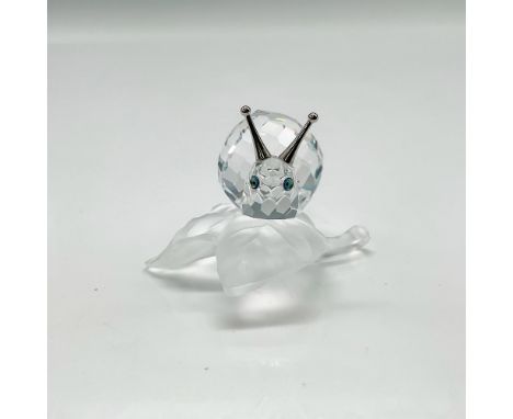 Part of the Among the Flowers and Foliage grouping, this figural has clear crystal body, amber crystal eyes and rhodium anten