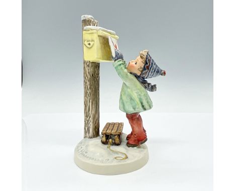 Hand-painted porcelain figurine depicting young boy excitedly posting his letter to Santa. Goebel TMK5. Issued: 1972-1979Dime