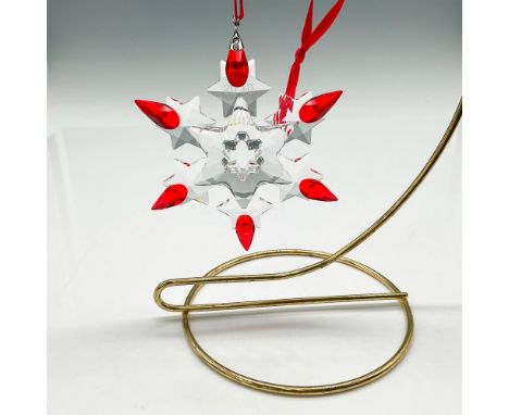 Clear crystal limited edition annual Christmas snowflake with 2010 acid mark on crystal and light siam colored crystal tips. 