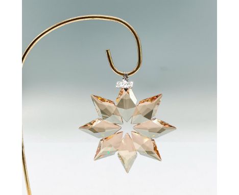Sparkling star shaped tree ornament in goldtone crystal. Swarovski mark. This item has its original box: 5.5"L x 6.25"W x 1"H
