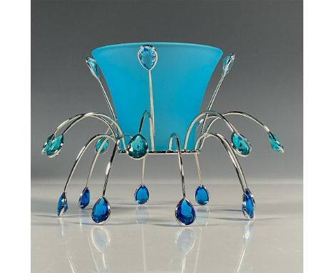 Delicate tea light that was part of the Crystal Jewels collection. A blue satin bowl that sits on a silver-tone metal base de