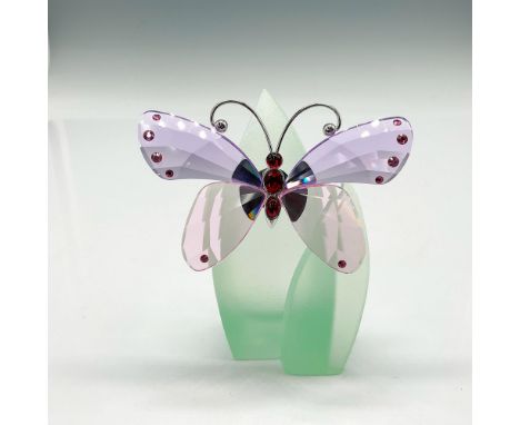 Lovely butterfly with violet wings, deep plum body and rhodium antennae resting on green satin crystal leaves. Swarovski back