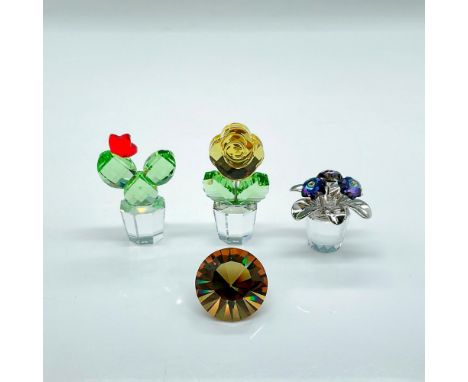 Three colorful faceted crystal flowers in clear base/pot. Blue primula has three blue/purple flowers with rhodium leaves. The