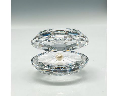 Open clear crystal with pearl at center. Swarovski backstamp. This item has its original box: 5"L x 5"W x 3.25"H. Certificate
