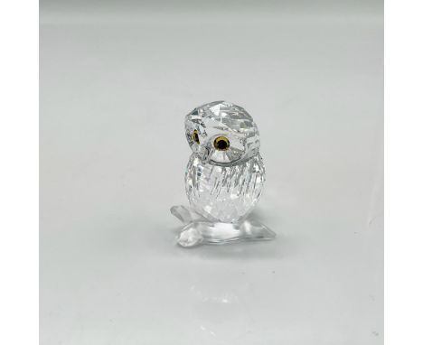 Part of the Feathered Beauties collection. Clear faceted crystal body with light topaz and jet crystal eyes standing on a sat