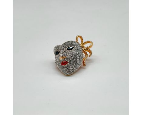 Gold toned metal with red enameled back and rhinestone crystal design with blue crystal eyes and red crystal lips. Swarovski 