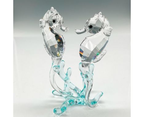 Part of the Aquatic Worlds collection. Clear faceted crystal bodies with jet crystal eyes balancing on smooth light azore cry