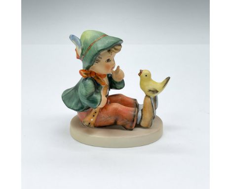Hand painted porcelain figurine depicting a Bavarian boy with bird. Goebel TMK 5. Issued: 1972-1979Dimensions: 3"L x 2"W x 3"