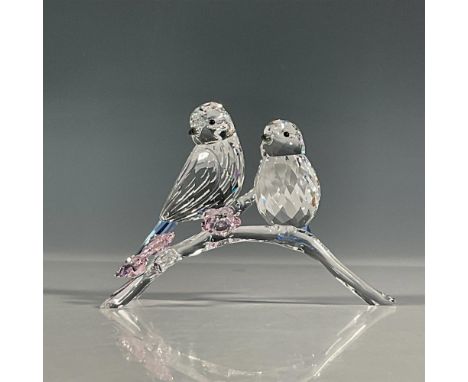 Pair of beautiful blue tits that sparkle in clear crystal with light sapphire crystal tails. Perched on a clear crystal base 