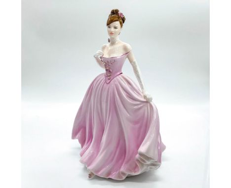 Limited edition rare and precious bone china figure depicting beauty in a stunning soft pink strapless gown adorned with beau