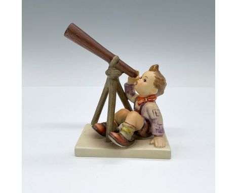 Matte porcelain figurine capturing a boy's wonder through a telescope. Goebel TK5. Issued: 1972-1979Dimensions: 4"L x 2.75"W 