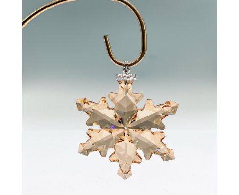 Brilliant star or snowflake shaped tree ornament in goldtone crystal. Swarovski mark. This item has its original box: 5.5"L x